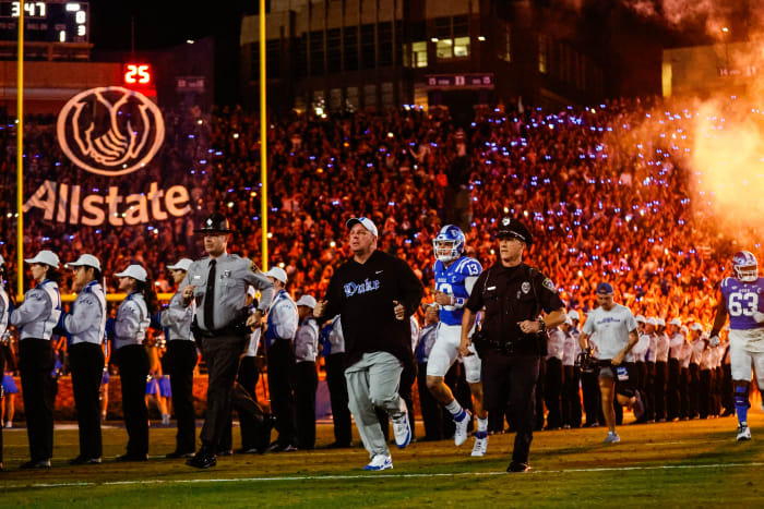 Sep 30, 2023; Durham, North Carolina, USA; Duke Blue Devils head coach Mike Elko runs out just before the game against Notre Dame Fighting Irish at Wallace Wade Stadium.